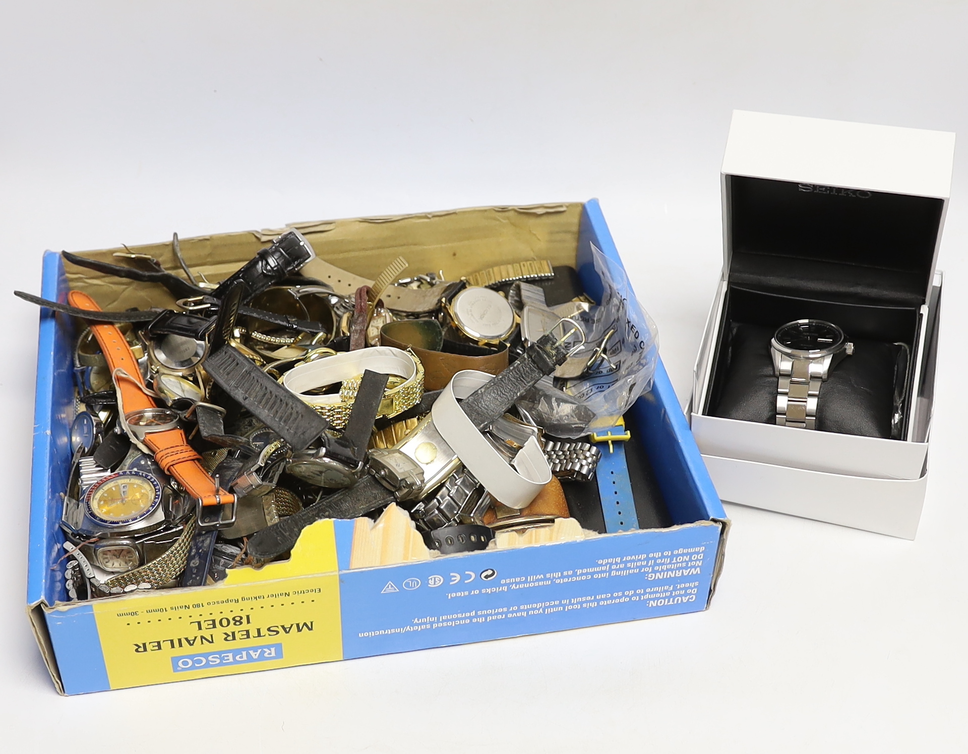 A collection of assorted modern wrist watches, including Seiko Sports, Lorus, Timex, etc.